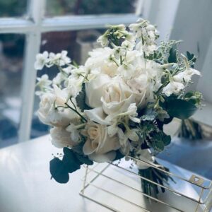 Cream white roses with delphinium