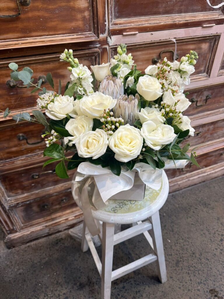 Floral Arrangement with Protea arranged by Sun's Florist, Kogarah