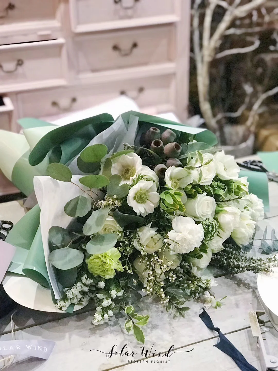 Green and White seasoning flower arrangement